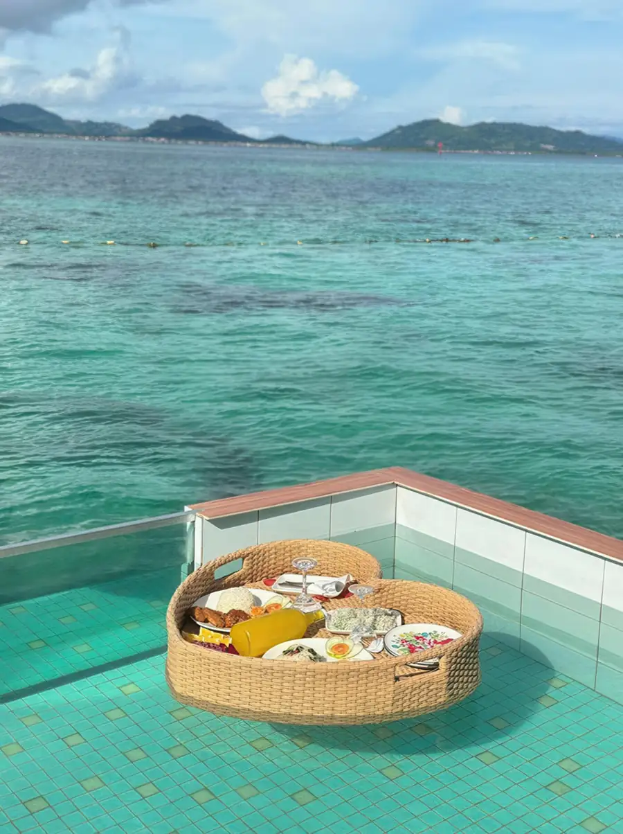 Modern balcony with an infinity pool at Dayang Resort Semporna, open to the Celebes Sea.