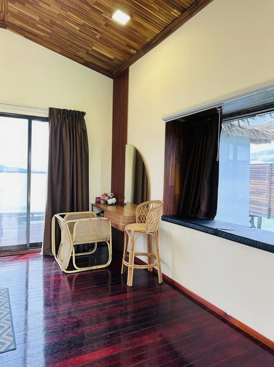Sea view vanity room at Dayang Resort Semporna with ocean glimpsed through the window.
